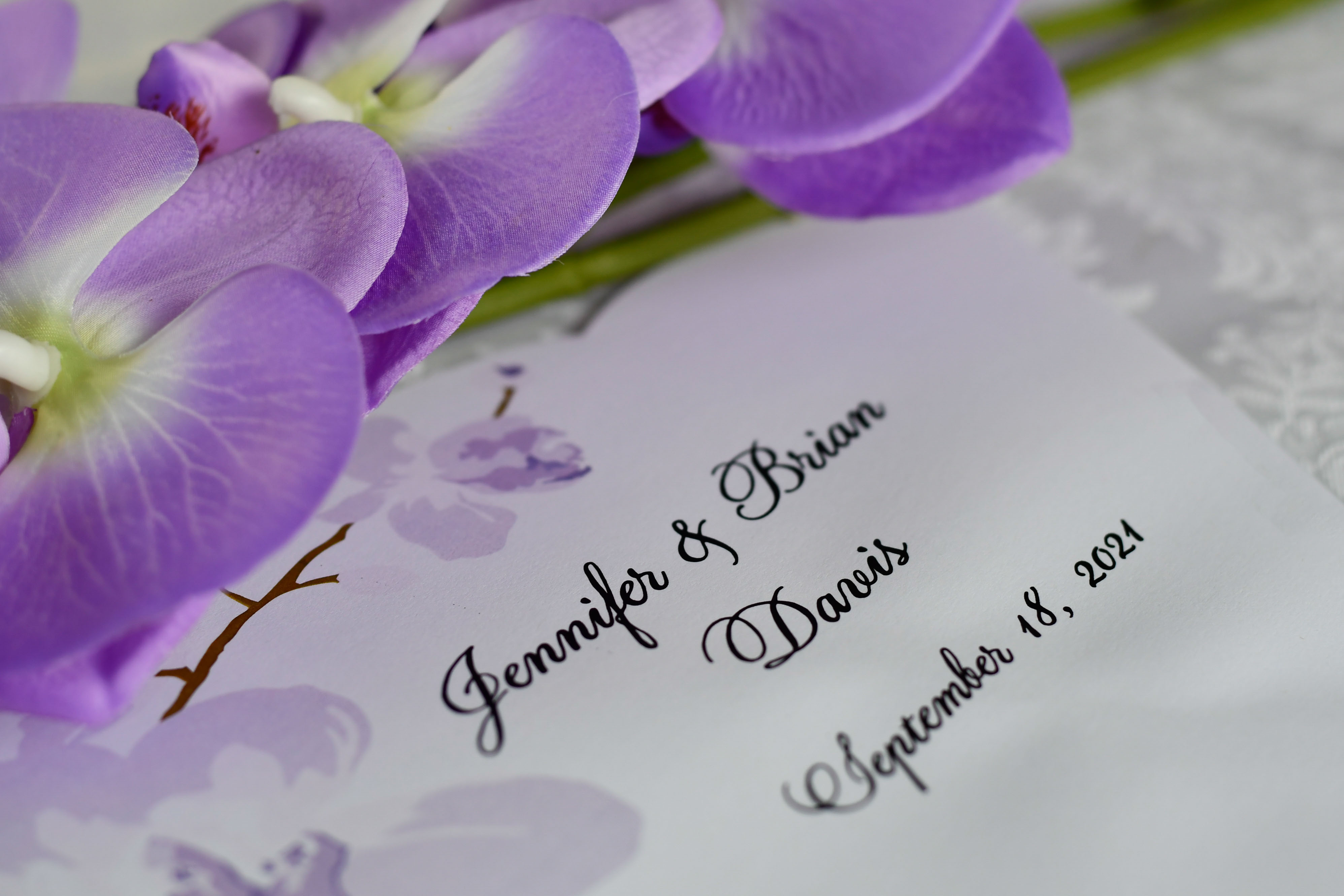 Wedding program with orchids