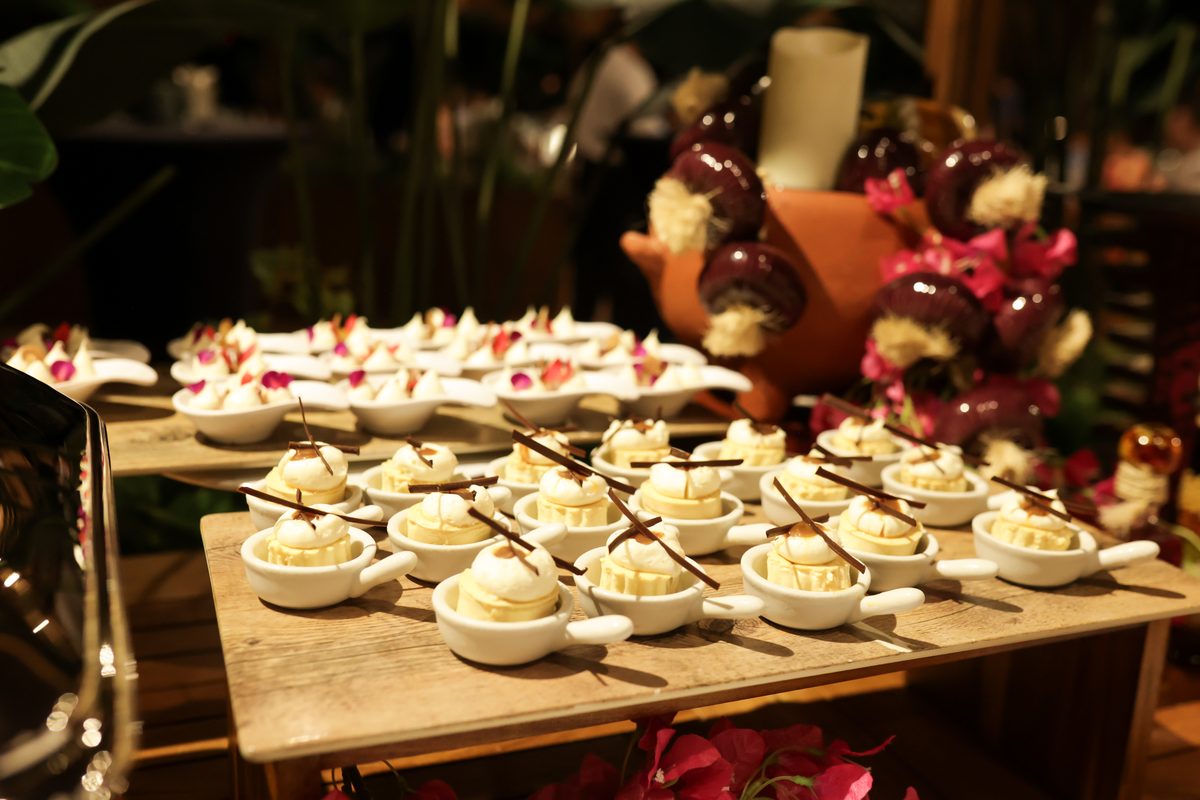 Vanilla dessert cups with florals at a client appreciation event